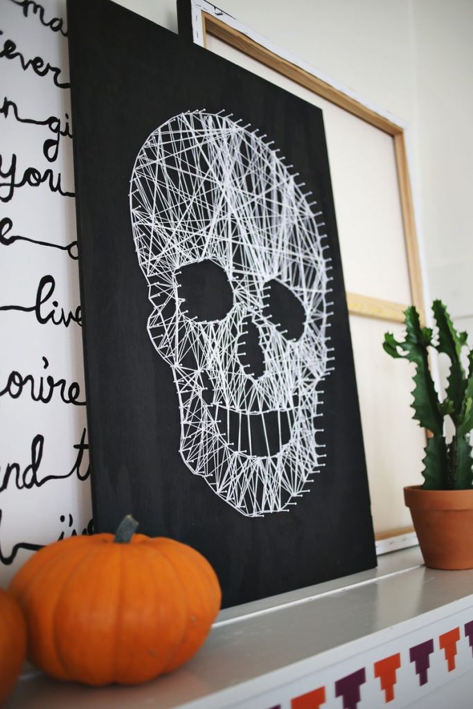 Halloween crafts for tweens and teens: Skull string art craft DIY at A Beautiful Mess
