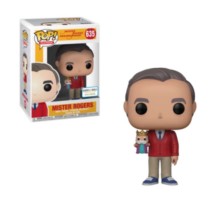 This Funko pop Mister Rogers vinyl figure has him in a red cardigan holding King Friday. This Funko pop Mister Rogers vinyl figure has him in a red cardigan holding King Friday.