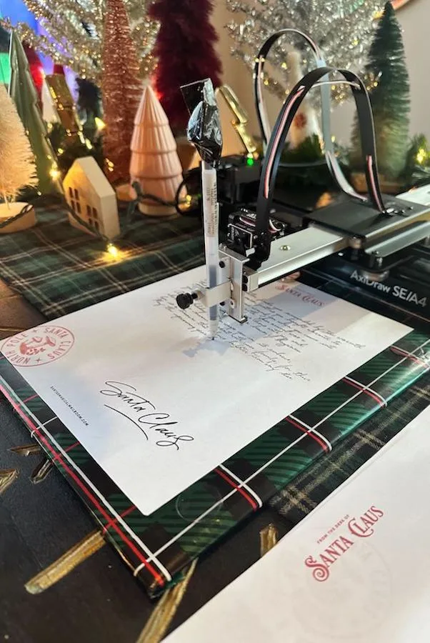 Letters from Santa's Magic Mailroom are composed with this unique handwriting printer.