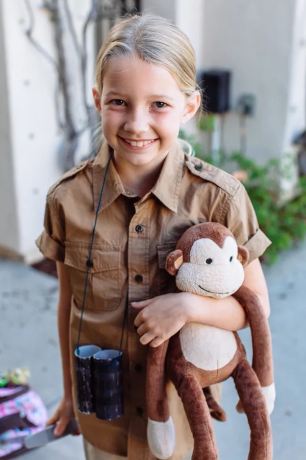 Jane Goodall-inspired kids costume (stuffed monkey + brown shirt)