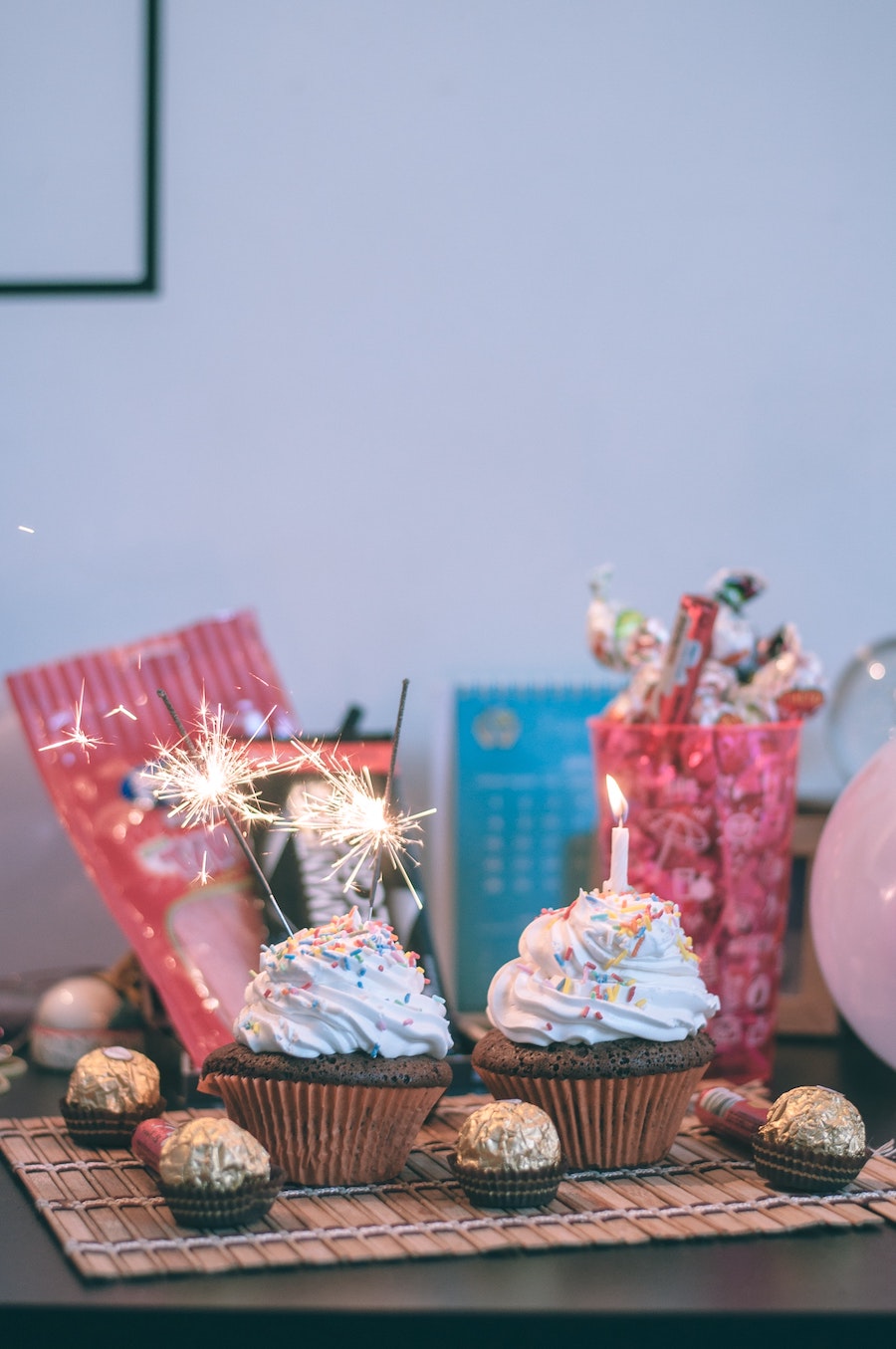 Adoption anniversary celebration ideas: Blow out candles on your family anniversary cake! | Photo by Wesley Caribe on Unsplash