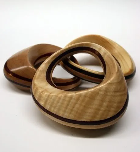 A baby rattle keepsake in shining...wood
