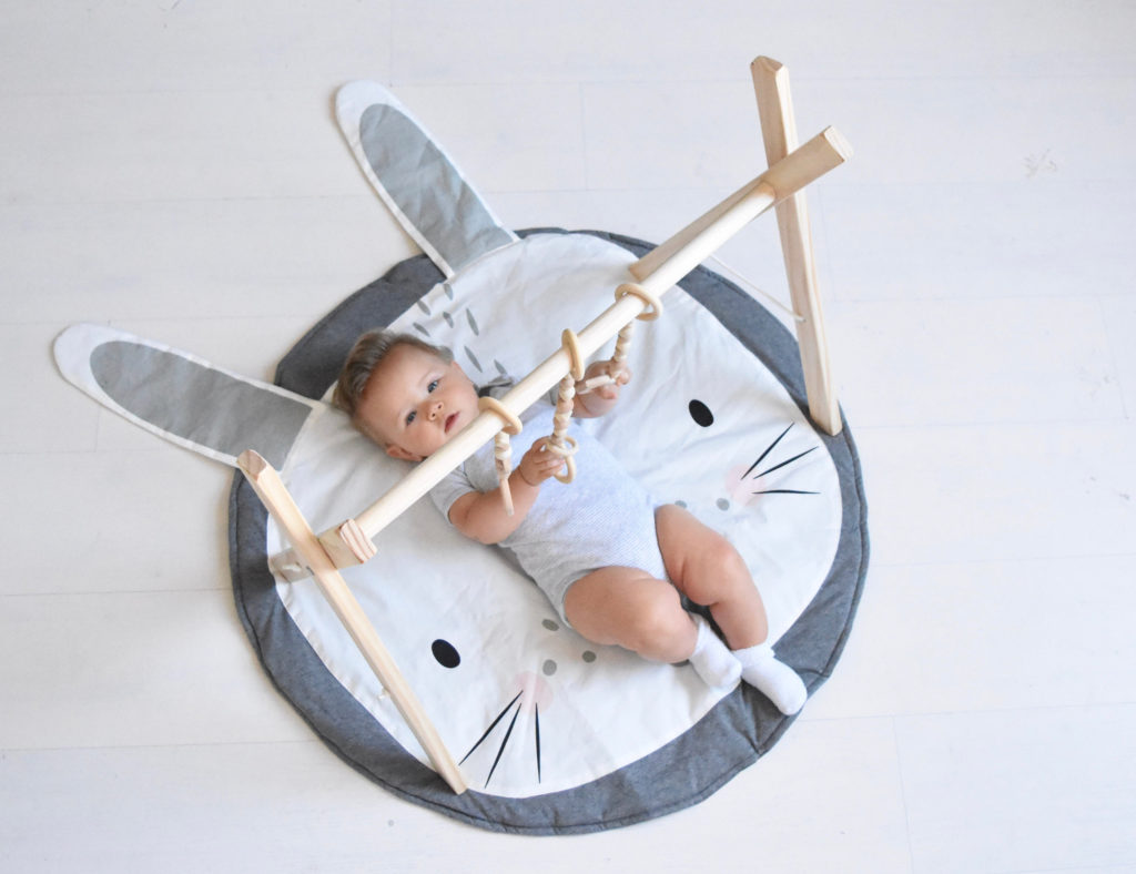 Best baby shower gifts under $100: Handmade baby gym from Poppyseed Play