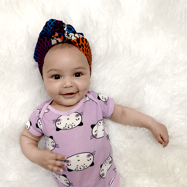 Unique baby shower gifts: A Marlo Bea baby headwrap or bow with fabric honoring the baby